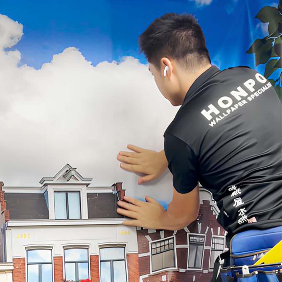 honpo professional wallpaper installer working on a landscape city mural wallpaper